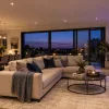Illustration of white downlights and coloured accent lighting in a modern living room