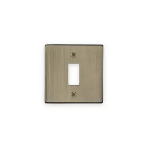 Knightsbridge GDCS1AB antique brass one gang grid faceplate with central module opening and two fixing screws