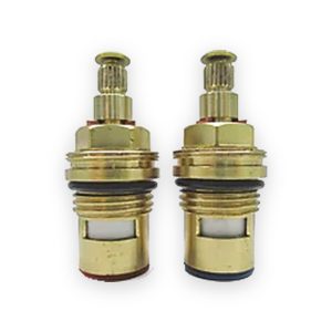 Pair of brass quarter-turn ceramic tap cartridges with splined stems, white inserts and red and black base seals