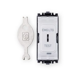 MK emergency lighting test key switch front with white EMG LTG TEST face and separate metal MK key