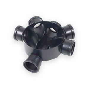 Black plastic inspection chamber base with open top, internal channels and multiple pipe connection sockets